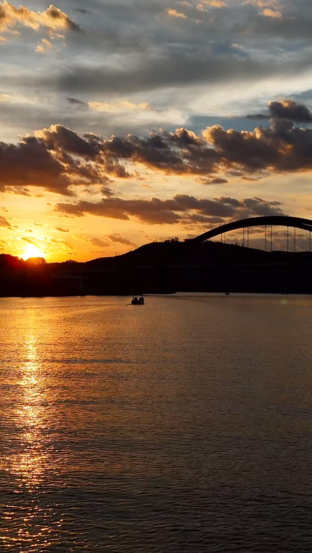 Arc electric boat sunset drone chase at the 360 Bridge