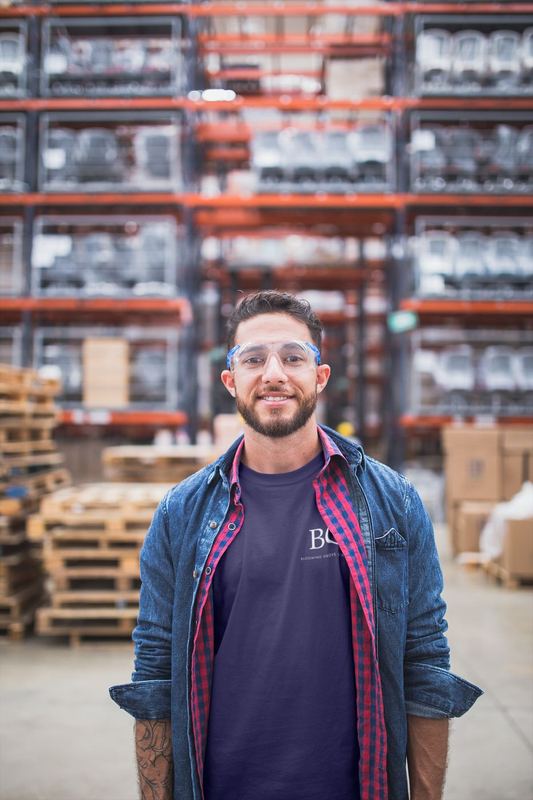 smiling warehouse worker wearing a t shirt mockup a20450 — BGS Mockups