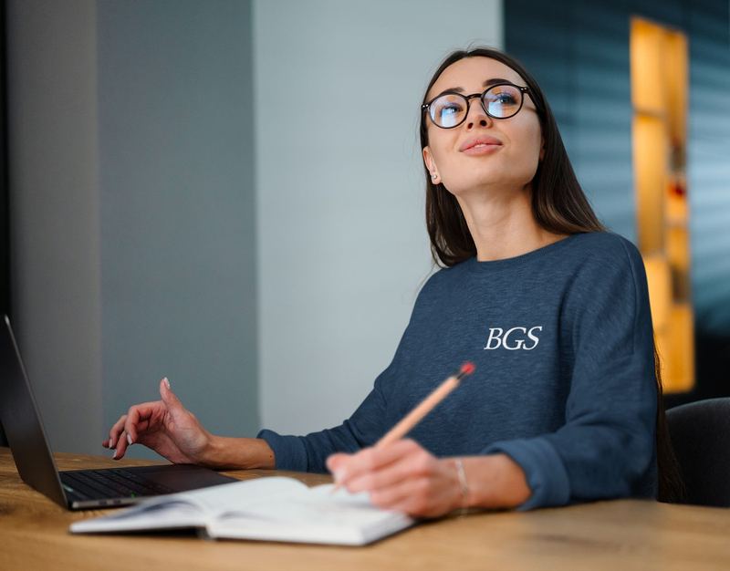 sweatshirt mockup of a woman with glasses working m12617 r el2 — BGS Mockups