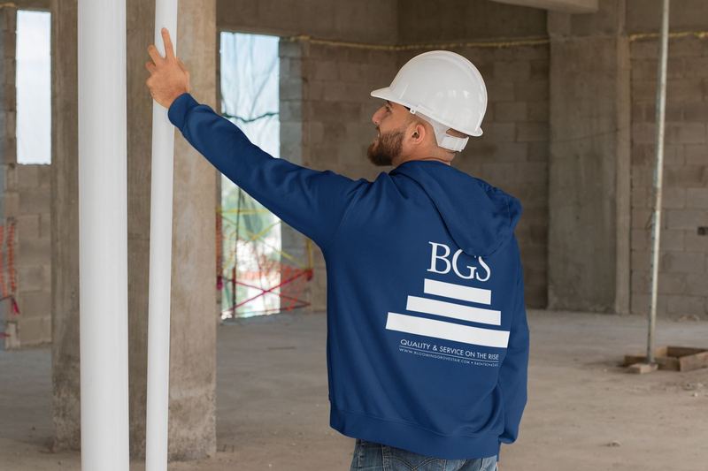 mockup of a man wearing a hoodie and working on a construction 31540 — BGS Print