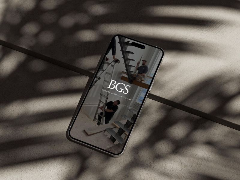 iPhone 14 Pro Max on Concrete Mockup 1.5 — BG Stair Logo