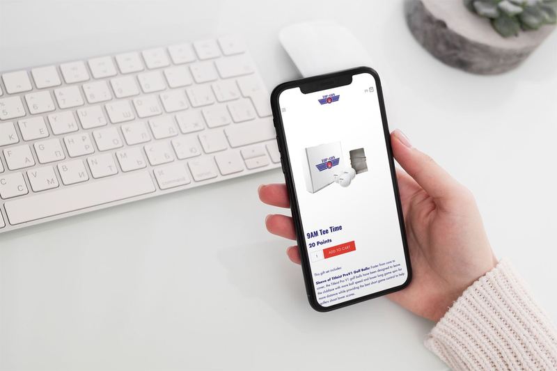 mockup featuring a woman s hand holding an iphone 11 pro over a neat desk 2158 el1 — Digital Gift Suite email