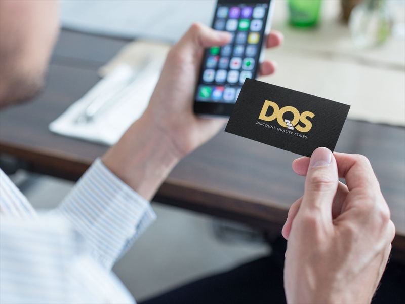 mockup of a business man using a business card to contact a person with his phone a15032 copy — DQS Pictures