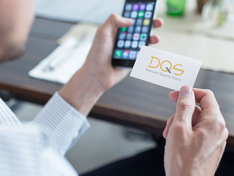 mockup of a business man using a business card to contact a person with his phone a15032 — DQS Pictures