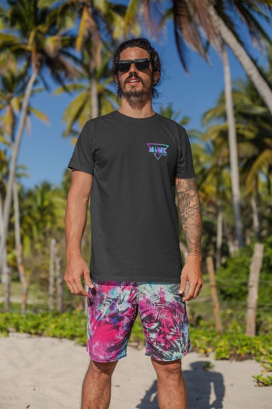 t shirt mockup of a man with surfer shorts standing at the beach 26755 — Mink Apparel