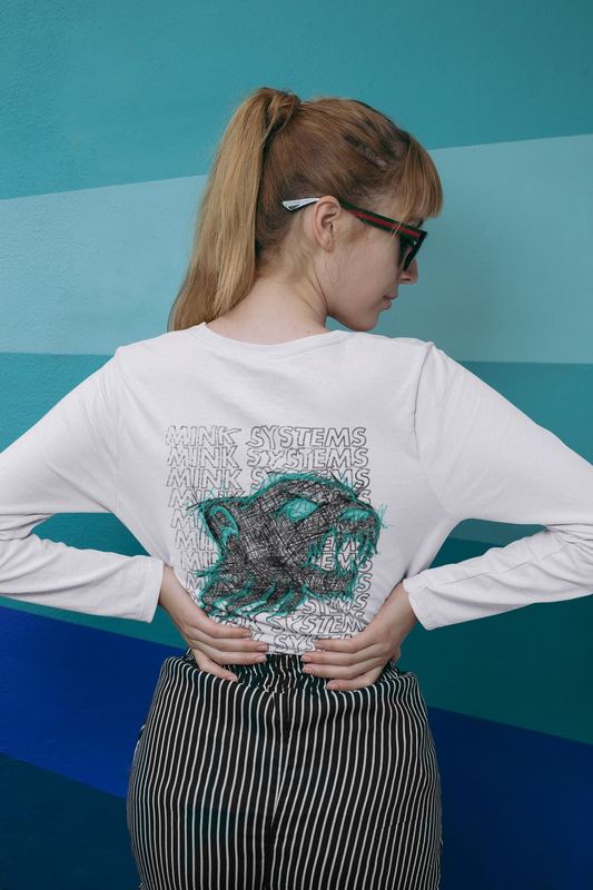 mockup of a woman wearing a long sleeve tee against a monochromatic background 29056 — Mink Apparel