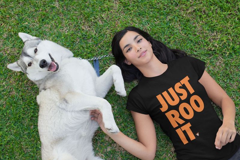 t shirt mockup of a woman lying on the grass with her dog 30660 — ROO Apparel Pics
