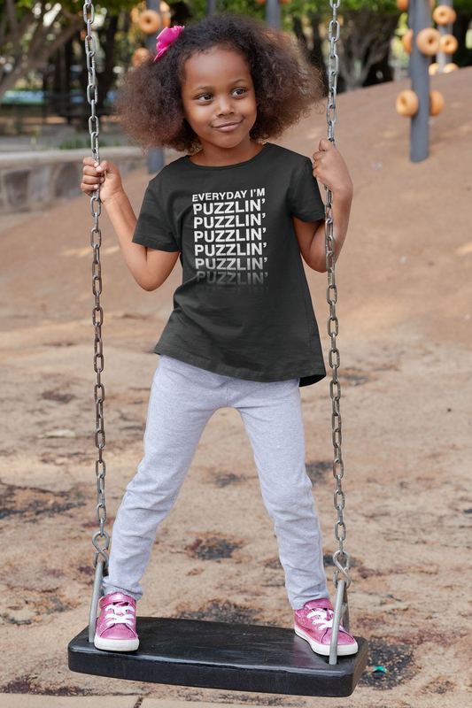 t shirt mockup of a playful girl standing on a swing 32179 (1) — PUZZLE SWAG